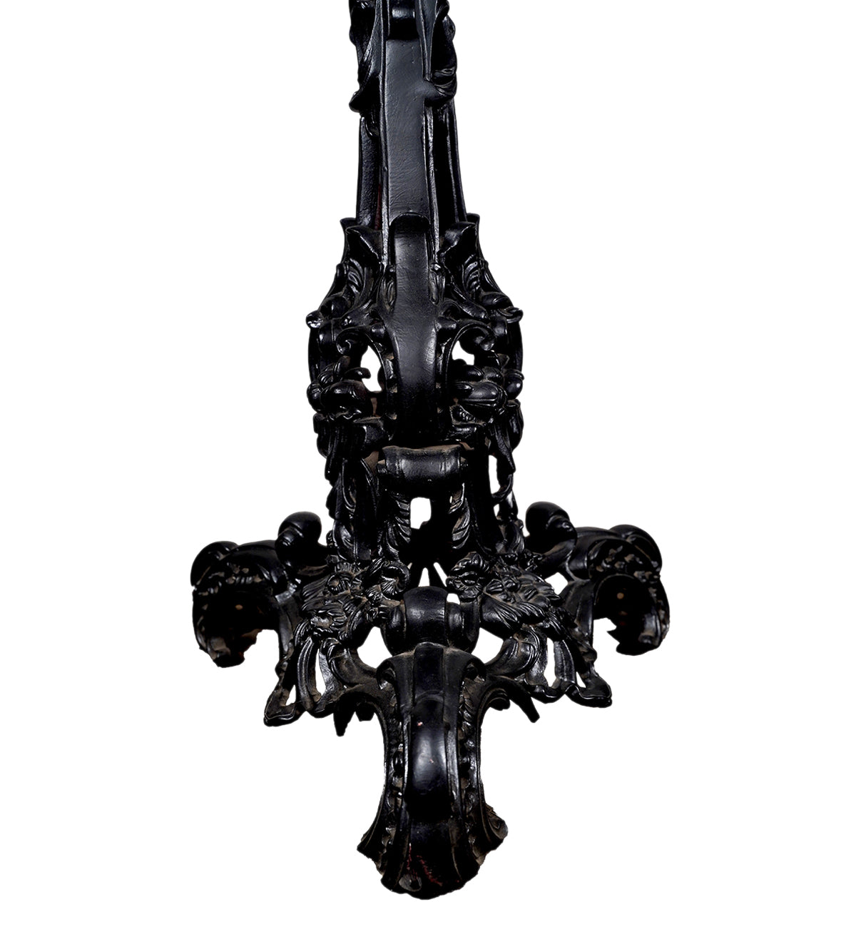 Close-up of intricate cast iron legs and carvings