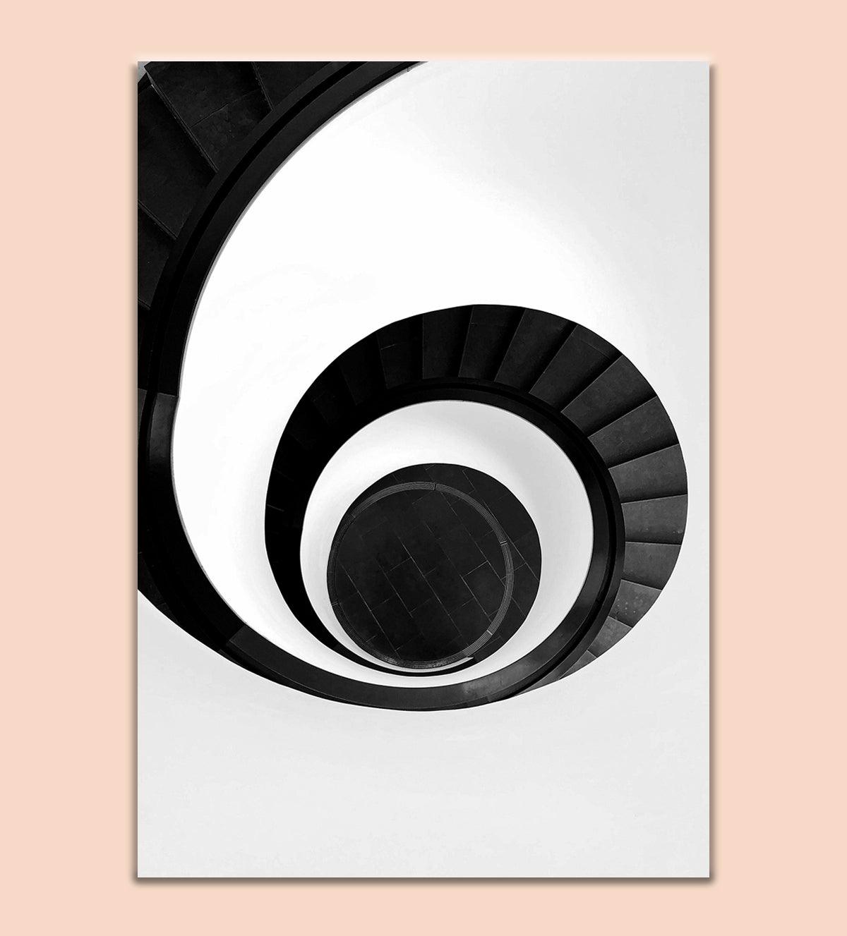 Add a touch of sophistication to your living space with "The Infinite Spiral", a striking black-and-white photograph featuring an elegant spiral staircase. This visually stunning art piece creates a sense of movement and depth, drawing the viewer's eye into the seemingly endless loop of the staircase’s curves. Its minimalist aesthetic seamlessly complements any modern or contemporary décor, making it an ideal focal point for your home or office - Aartaa decor