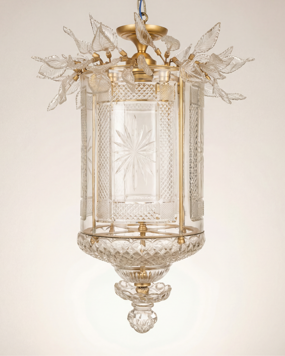 Decorative glass lantern with leaf designs on a plain background The Aaranya Noor Heritage Pendant Light is a celebration of refined Indian craftsmanship, designed and handcrafted entirely in-house by Aartaa Decor’s master artisans.