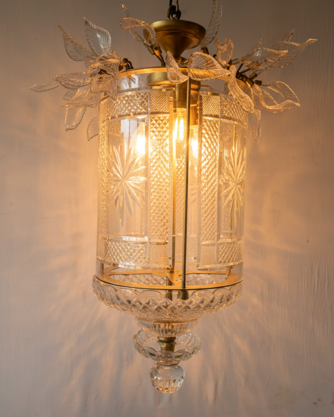 Decorative pendant light with intricate glass design on a neutral background The Aaranya Noor Heritage Pendant Light is a celebration of refined Indian craftsmanship, designed and handcrafted entirely in-house by Aartaa Decor’s master artisans.