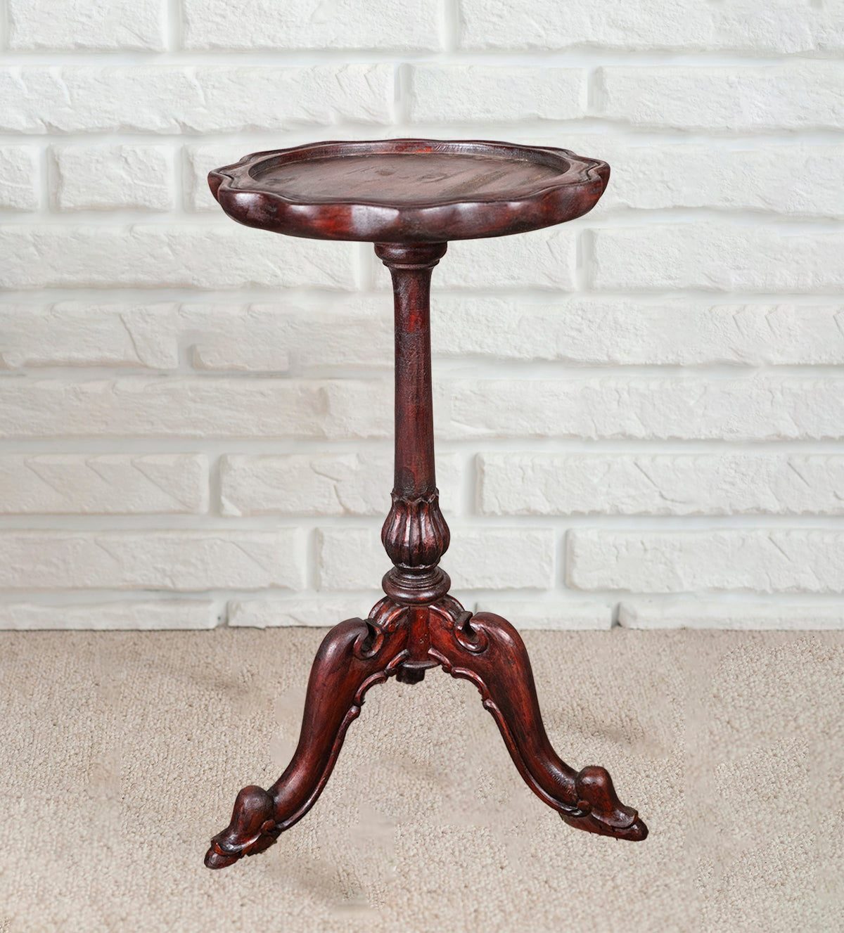 Vintage mahogany side table placed against white brick wall – Aartaa Decor