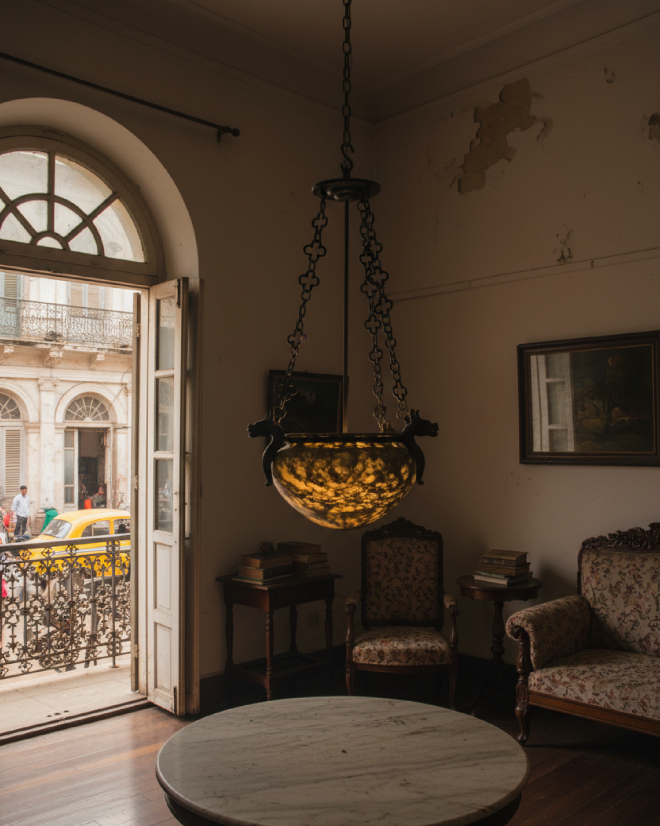 Handcrafted alabaster pendant light with intricate dragon crest design and ornate hanging chain, luxury lighting by Aartaa Decor