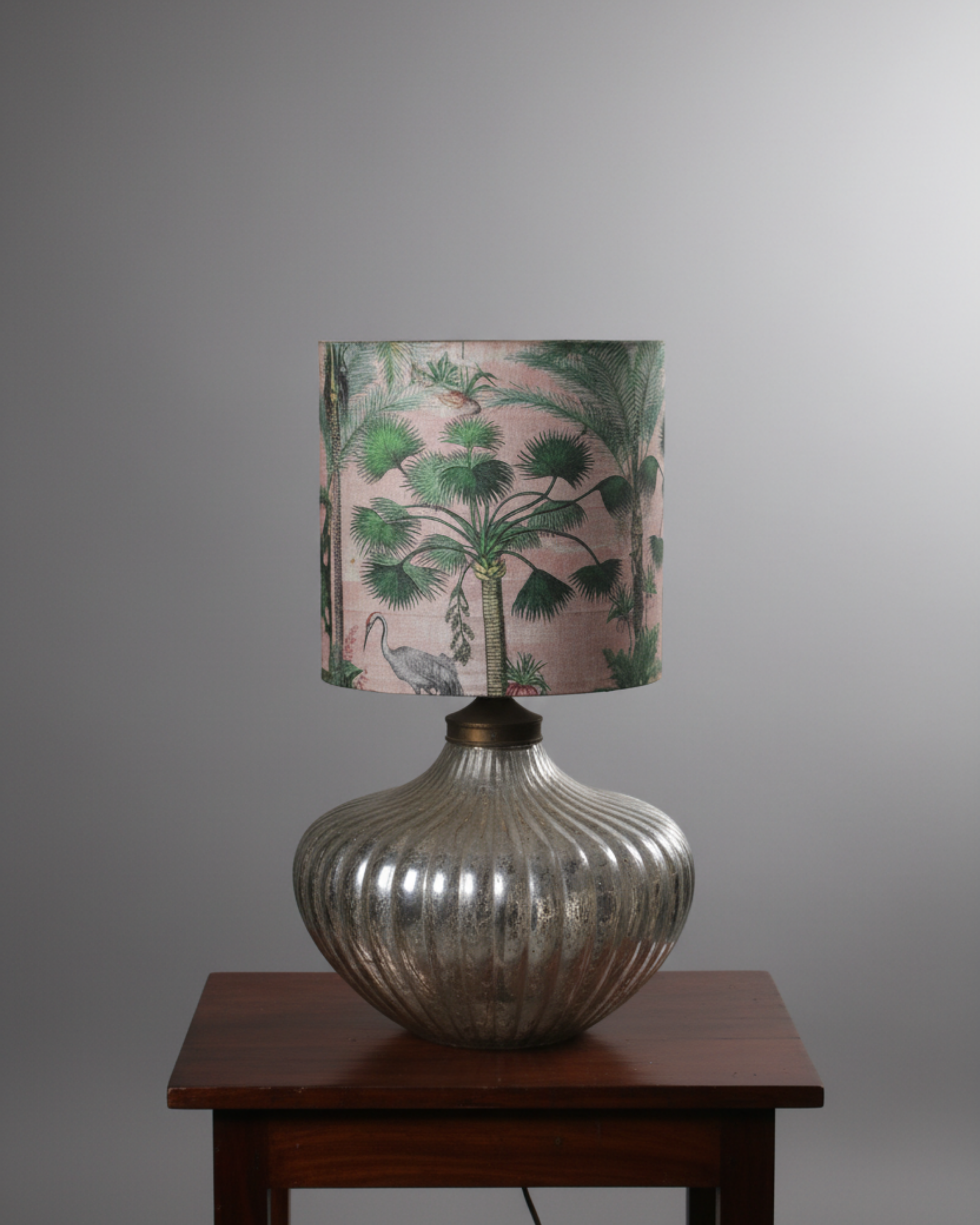 Elegant Botanical Glass Table Lamp with ribbed antique silver glass base and botanical palm print fabric shade, handcrafted in India, perfect for living room decor.