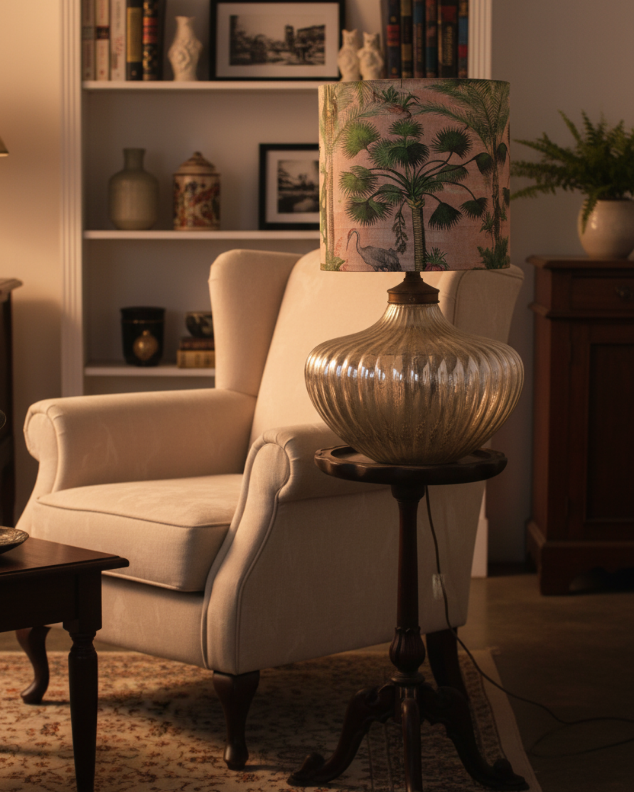 Cozy living room with a white armchair, side table, and decorative lamp.