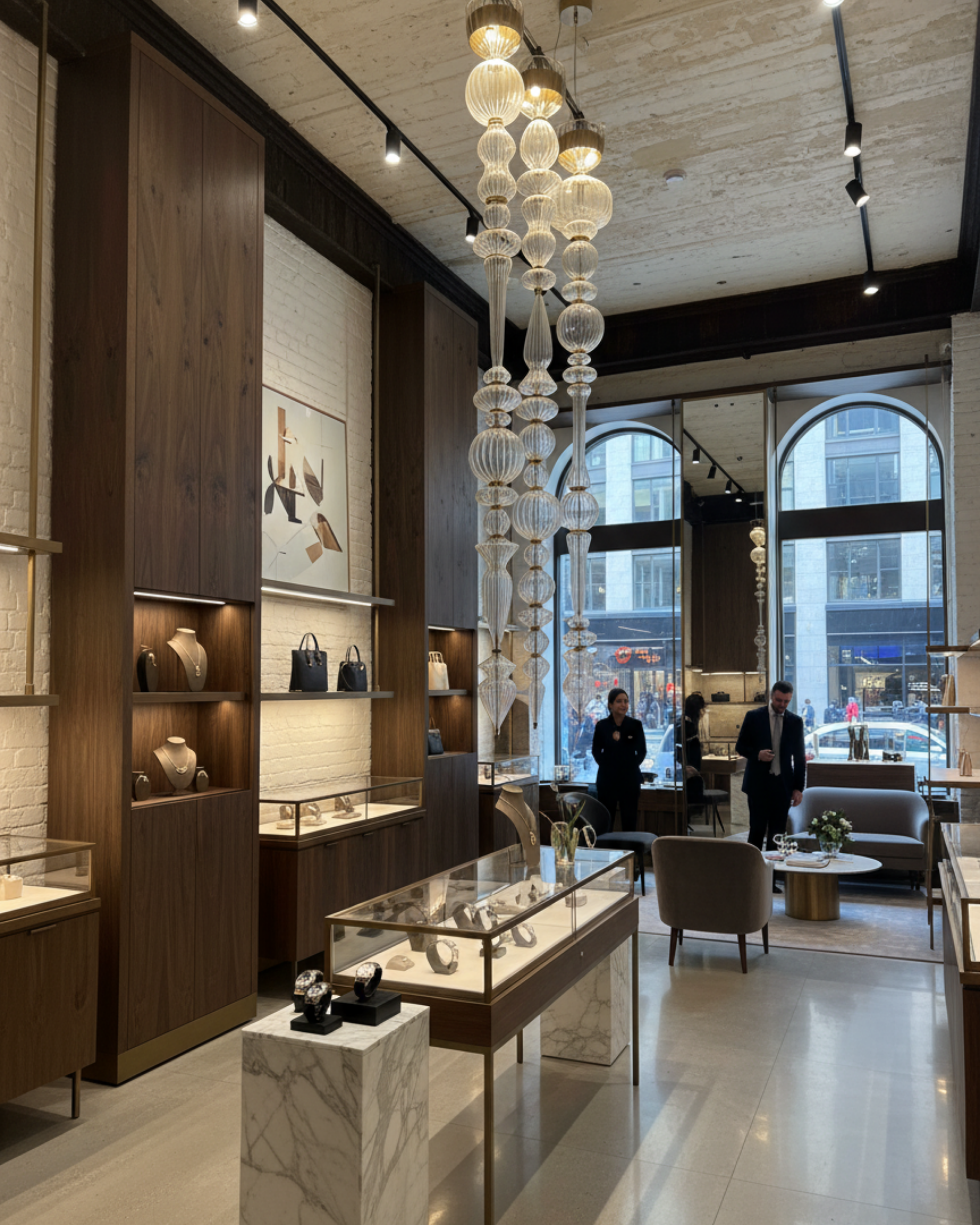 Modern interior design of a store with glass display cases and decorative lighting.