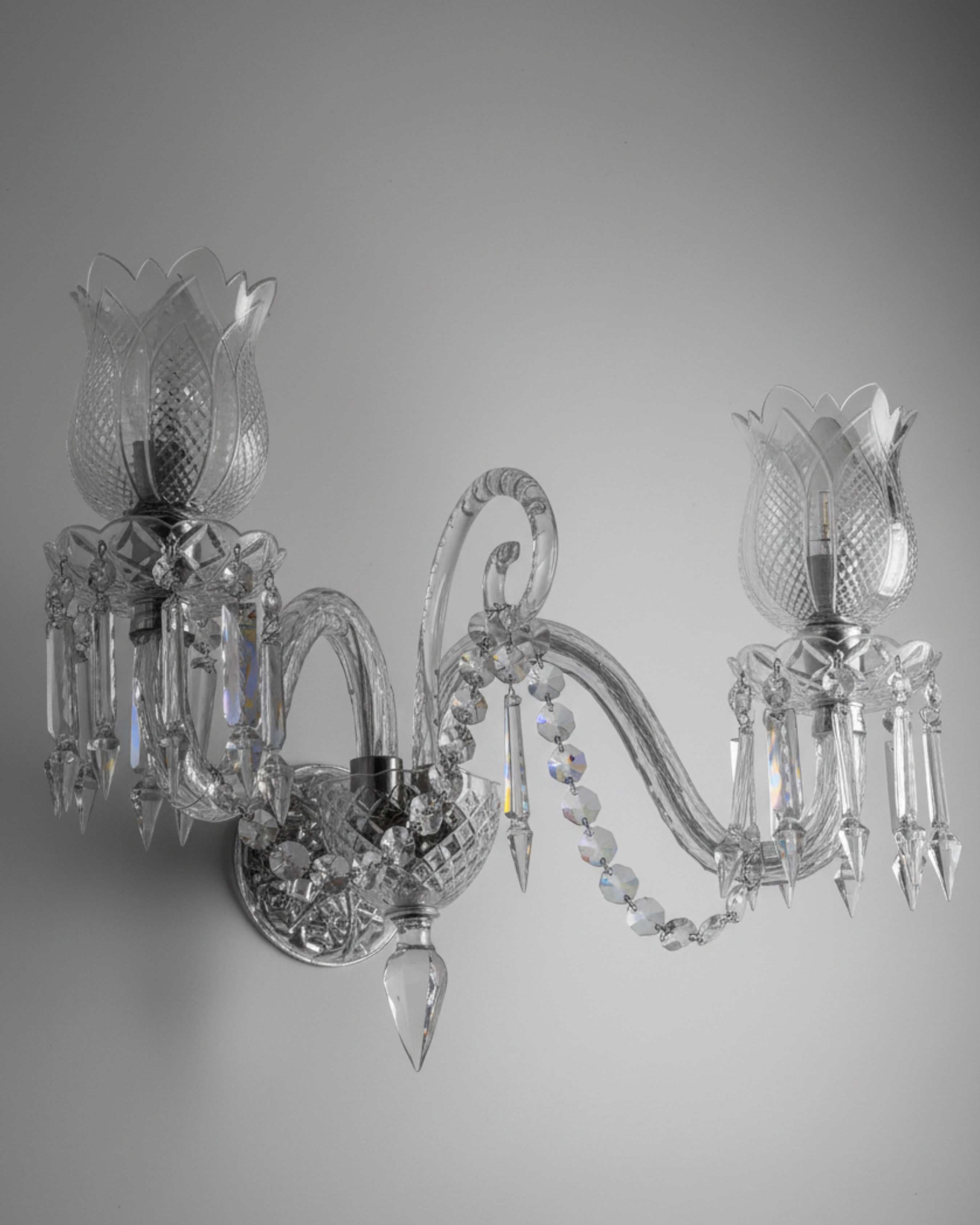 Eternal Bloom Crystal Wall Sconce – handcrafted luxury crystal wall light with dual tulip-inspired shades and cascading crystals by Aartaa Decor.