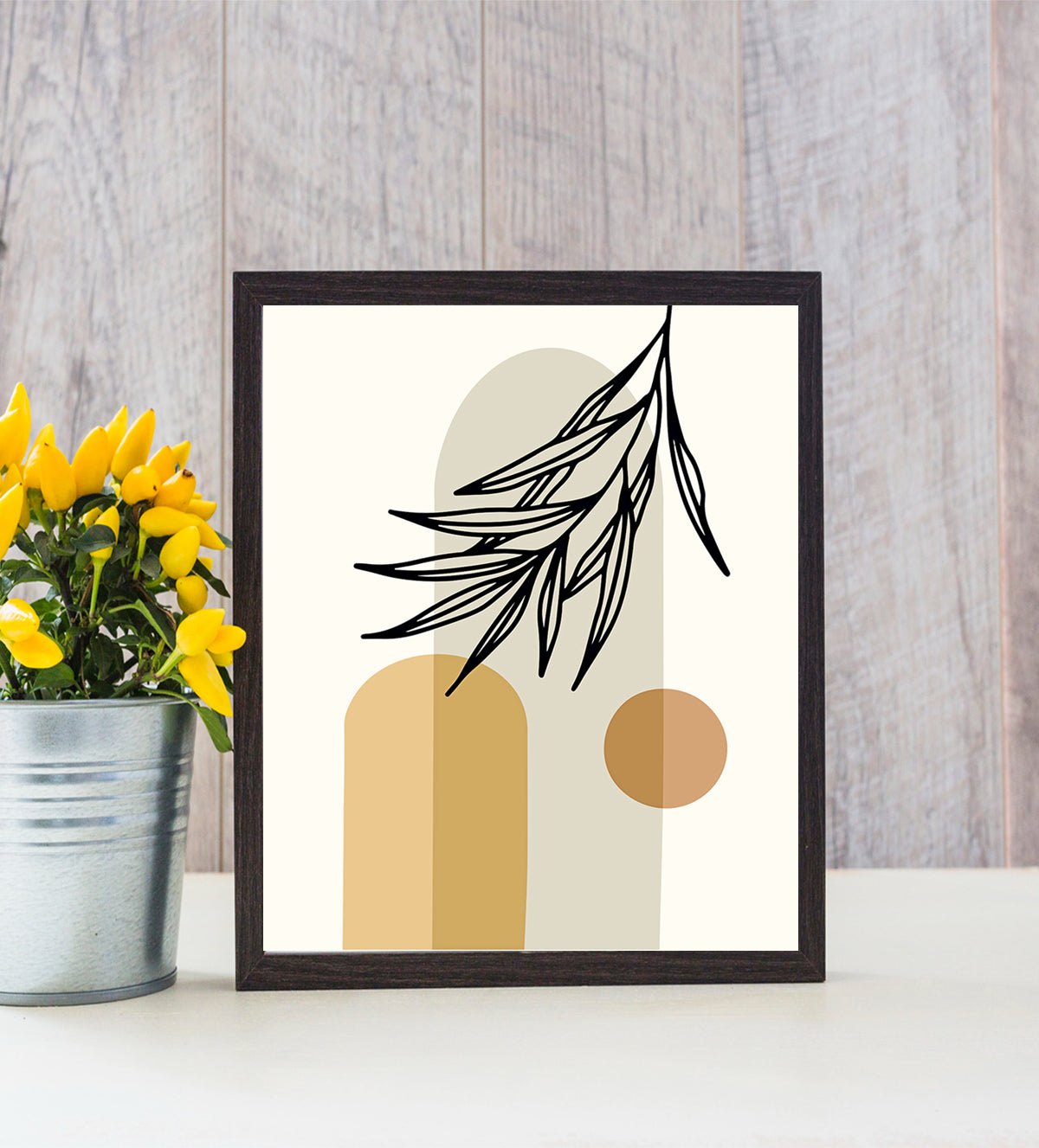 Harmony in Boho is a gorgeous piece of art that elegantly combines contemporary geometric patterns with earthy organic shapes to elevate any space. With its calming, smooth white background and overlapping organic shapes in warm, neutral tones, this alluring abstract artwork exudes calmness in any area. A strong focal point is created by a bright orange circle, and the composition is enhanced by the graceful silhouette of a palm leaf, which gives a touch of natural beauty - Aartaa decor