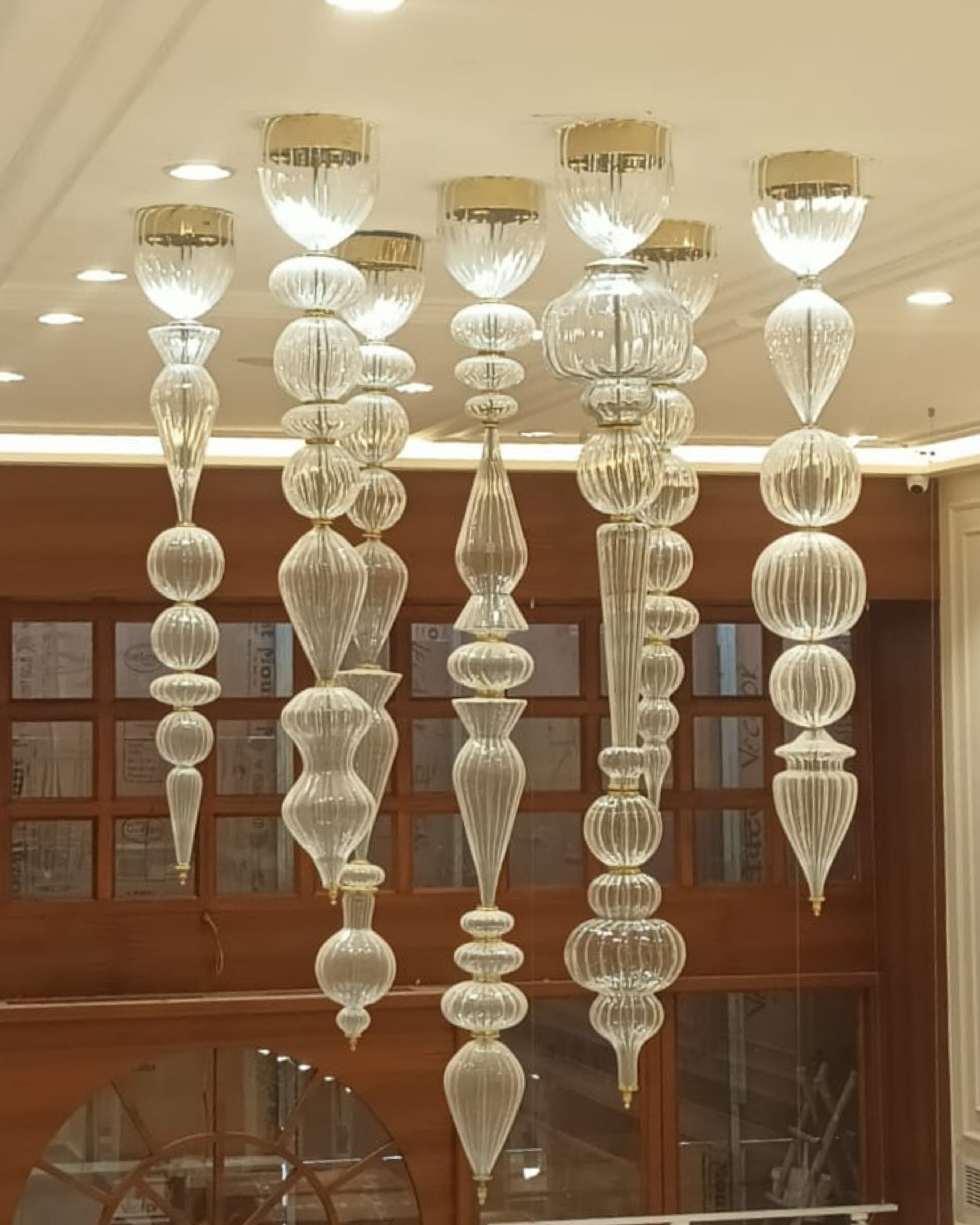 Ornate chandelier hanging from a ceiling in an indoor setting