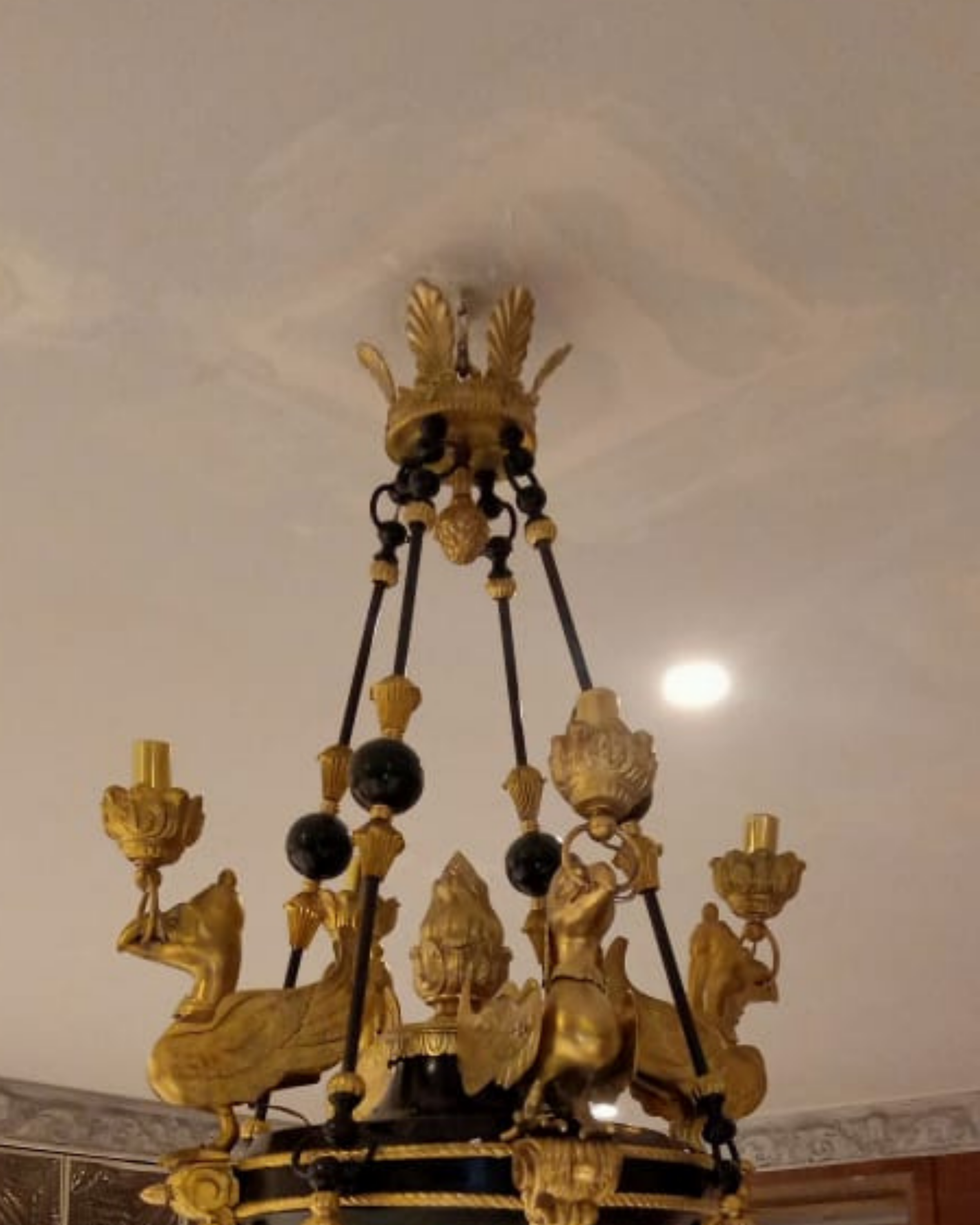 The Imperial Griffin Brass Chandelier – handcrafted luxury brass chandelier with six griffins, gilded gold and patinated black finish, 36 x 30 inches, made in India closeup shot