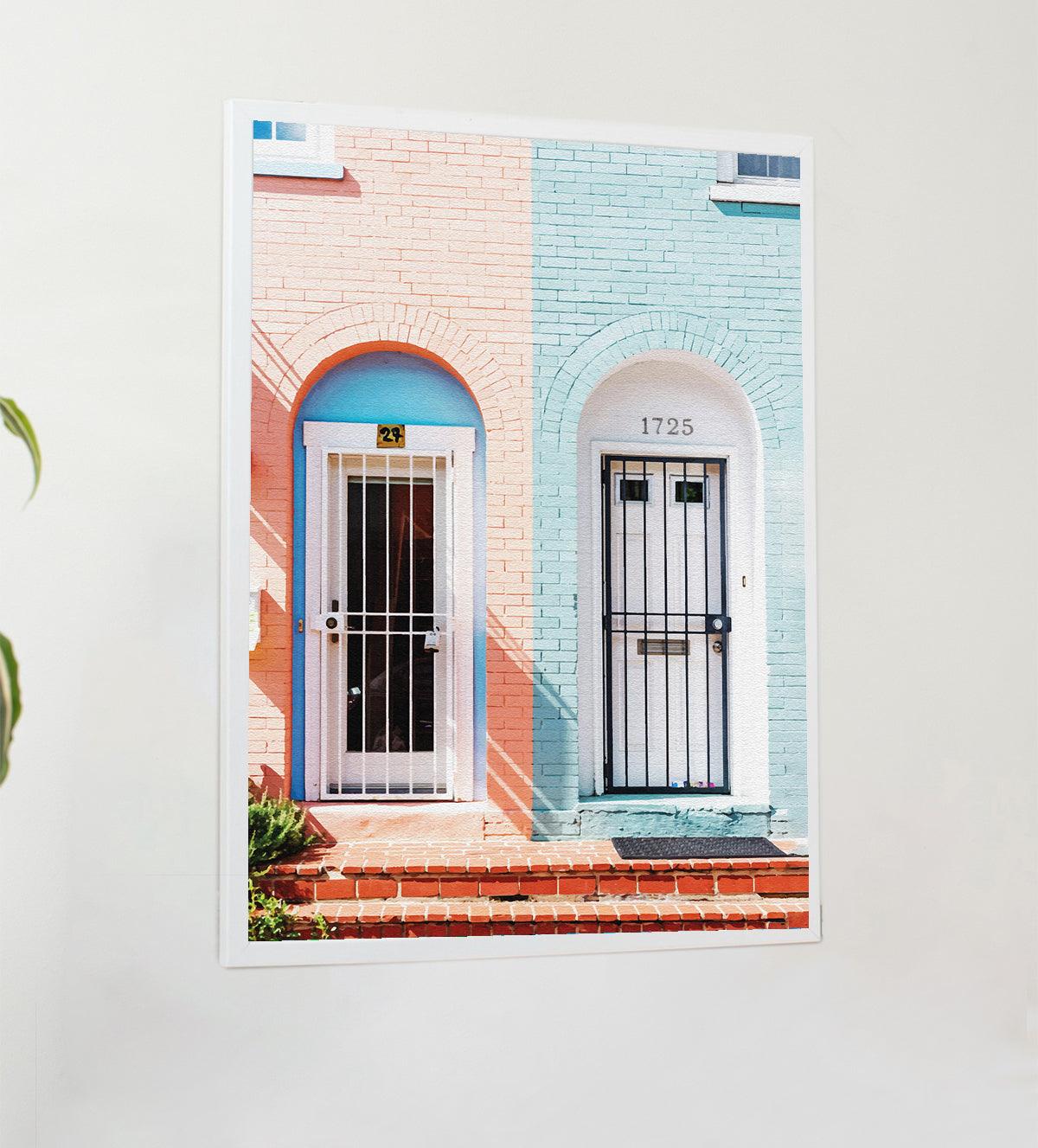 Urban Doors: Pop Culture Contrast in Pink & Blue." This eye-catching art piece showcases the charm of city streets, featuring a stunning door duo in bold pink and serene blue. The two-tone doors create a striking visual contrast, instantly energizing any room with a playful yet sophisticated aesthetic