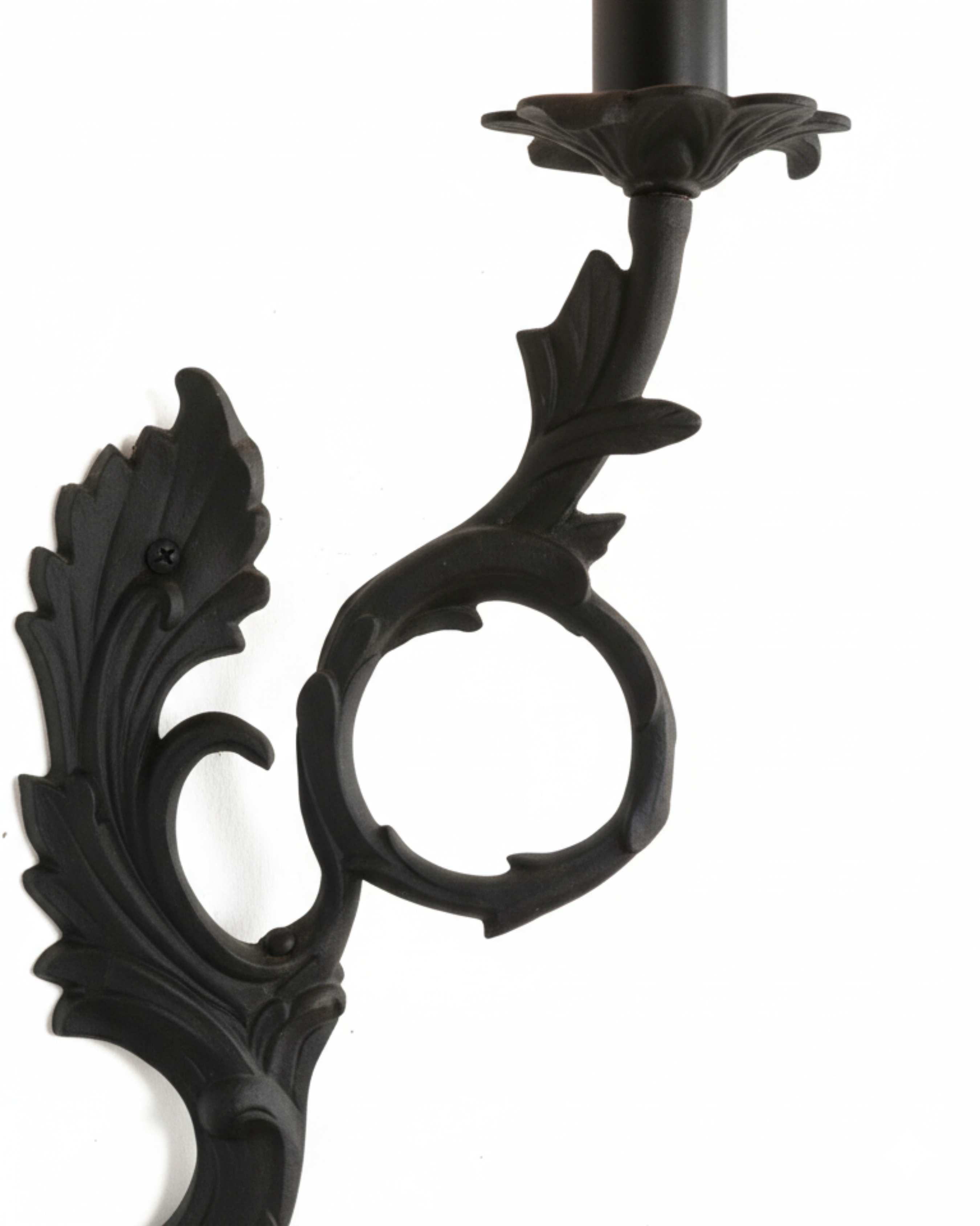Decorative black metal candle holder on a white background
