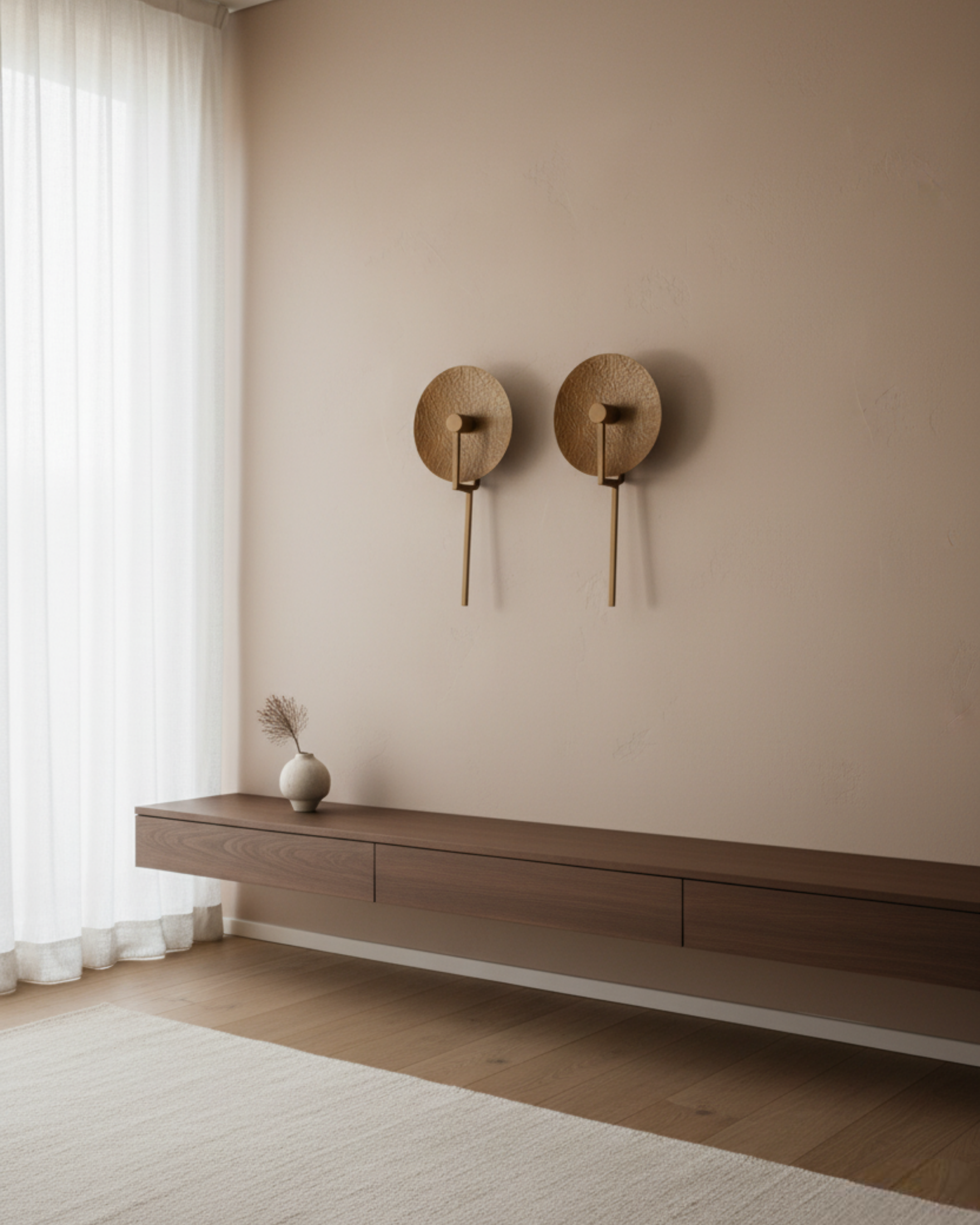 Aaranya Halo Wall Light Handcrafted Solid Brass Designer Wall Sconce | Made in India Minimalist room with wooden shelf and wall-mounted round decorative items.