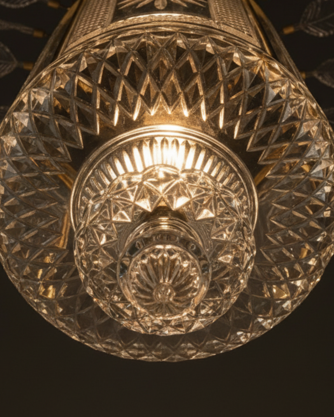 Decorative crystal light fixture with intricate design on a dark background The Aaranya Noor Heritage Pendant Light is a celebration of refined Indian craftsmanship, designed and handcrafted entirely in-house by Aartaa Decor’s master artisans.