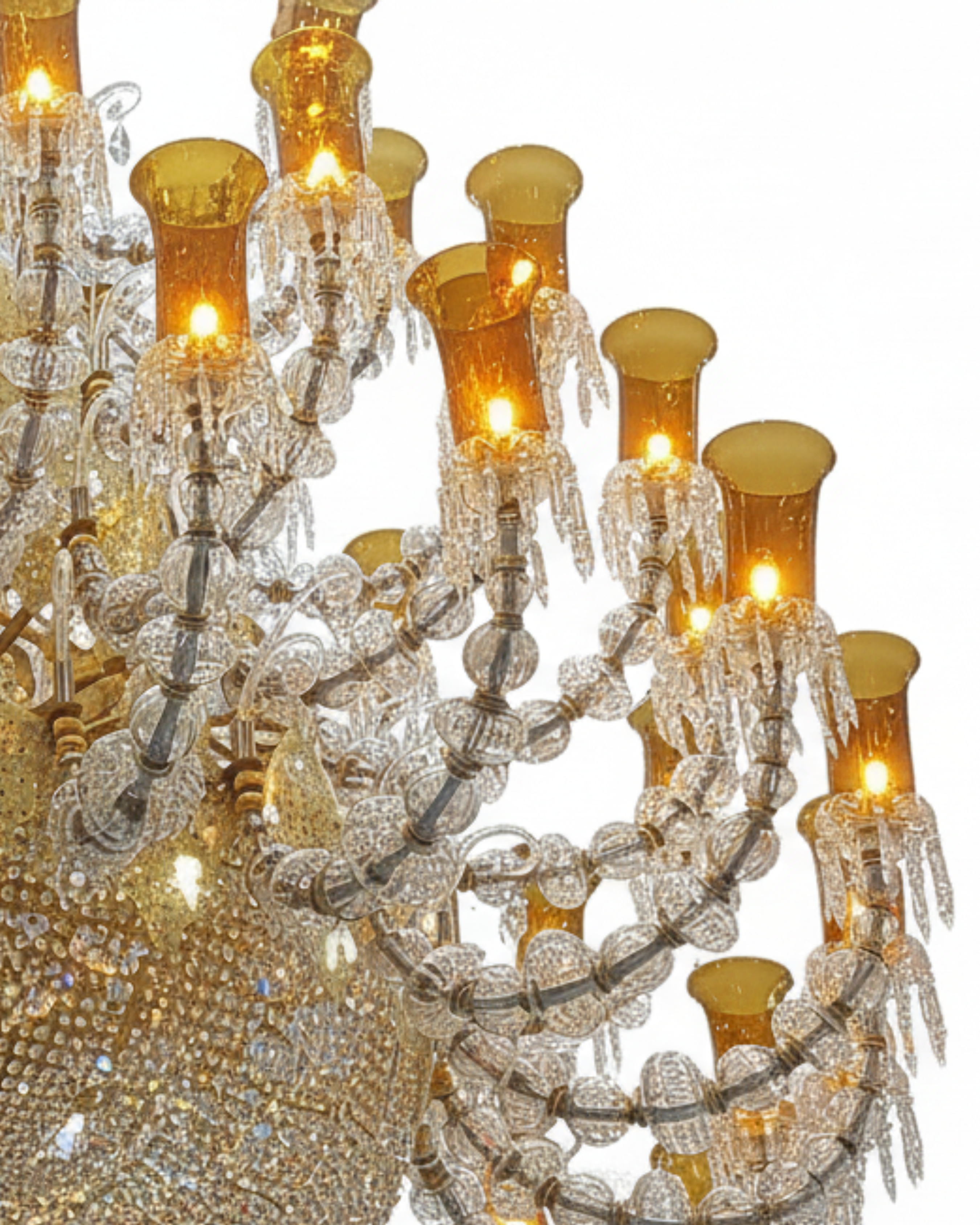 Close-up of a luxurious chandelier with crystal details and gold accents.