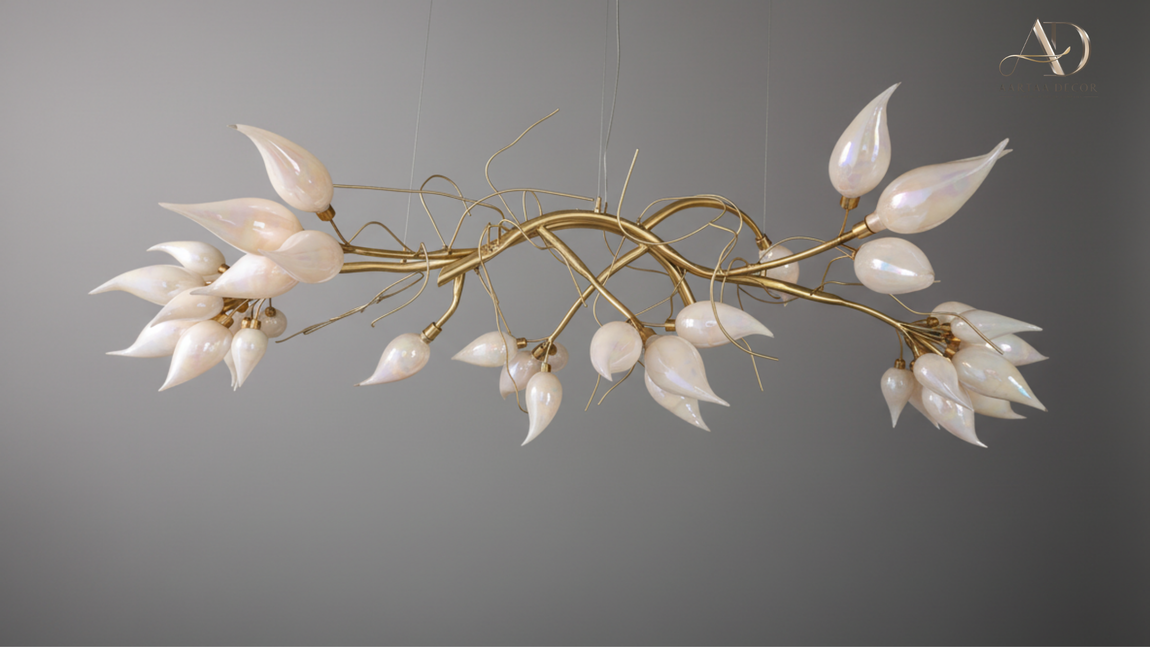 Decorative chandelier with white lampshades and gold branches on a gray background Vanshika Bloom Vine Chandelier – Handcrafted Brass Floral Sculpture Light