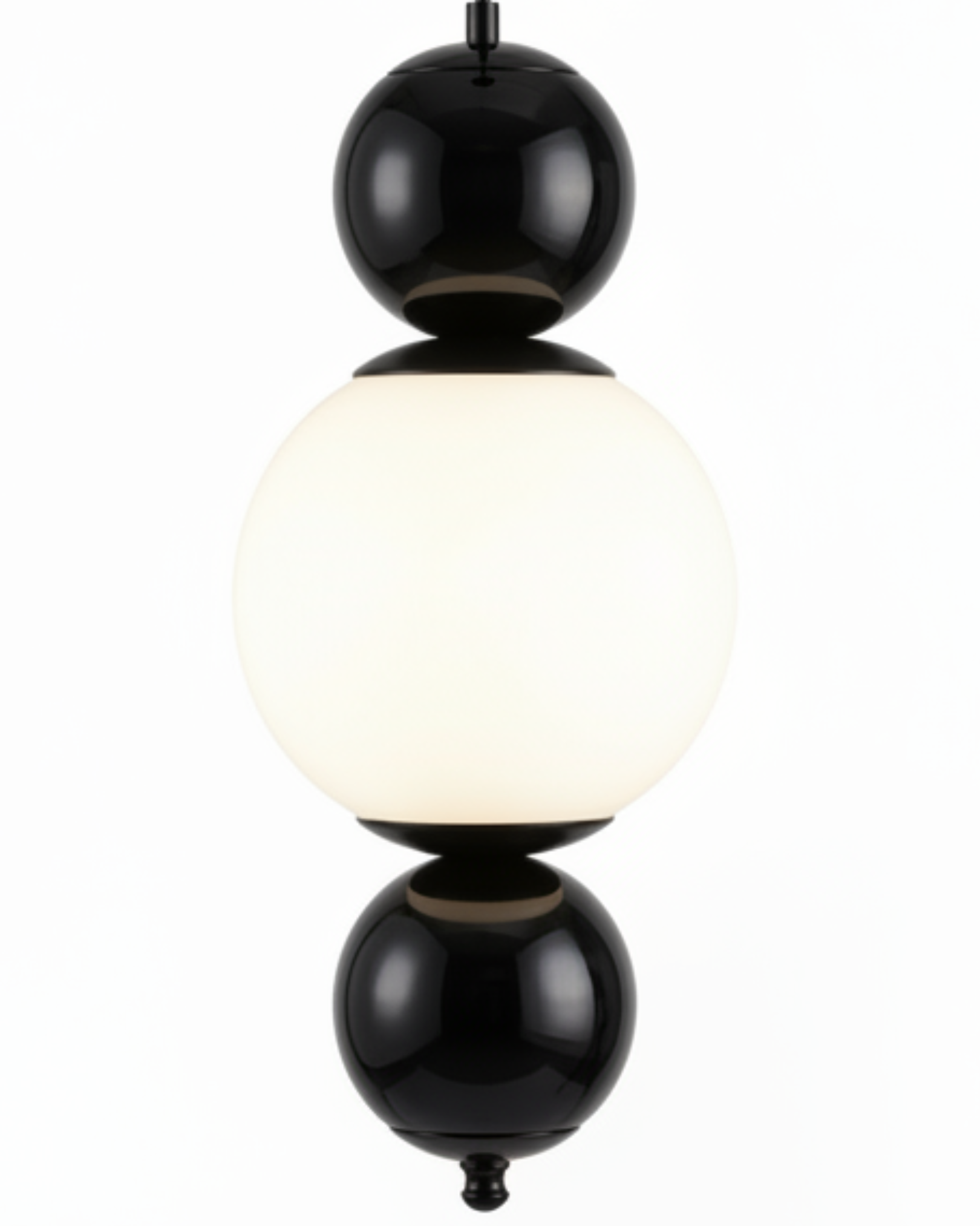 Modern pendant light with black and white spherical design on a white the Noor Orb Pendant Light is a statement of understated luxury. The design features a luminous handcrafted glass sphere, framed gracefully by solid brass accents that add warmth, contrast, and durability.background