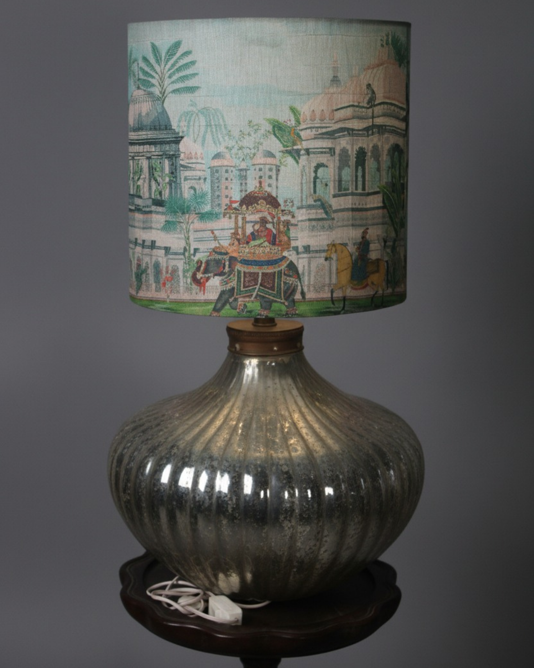 Designer bedside lamp with golden glass base and cultural print fabric shade from Aartaa Decor